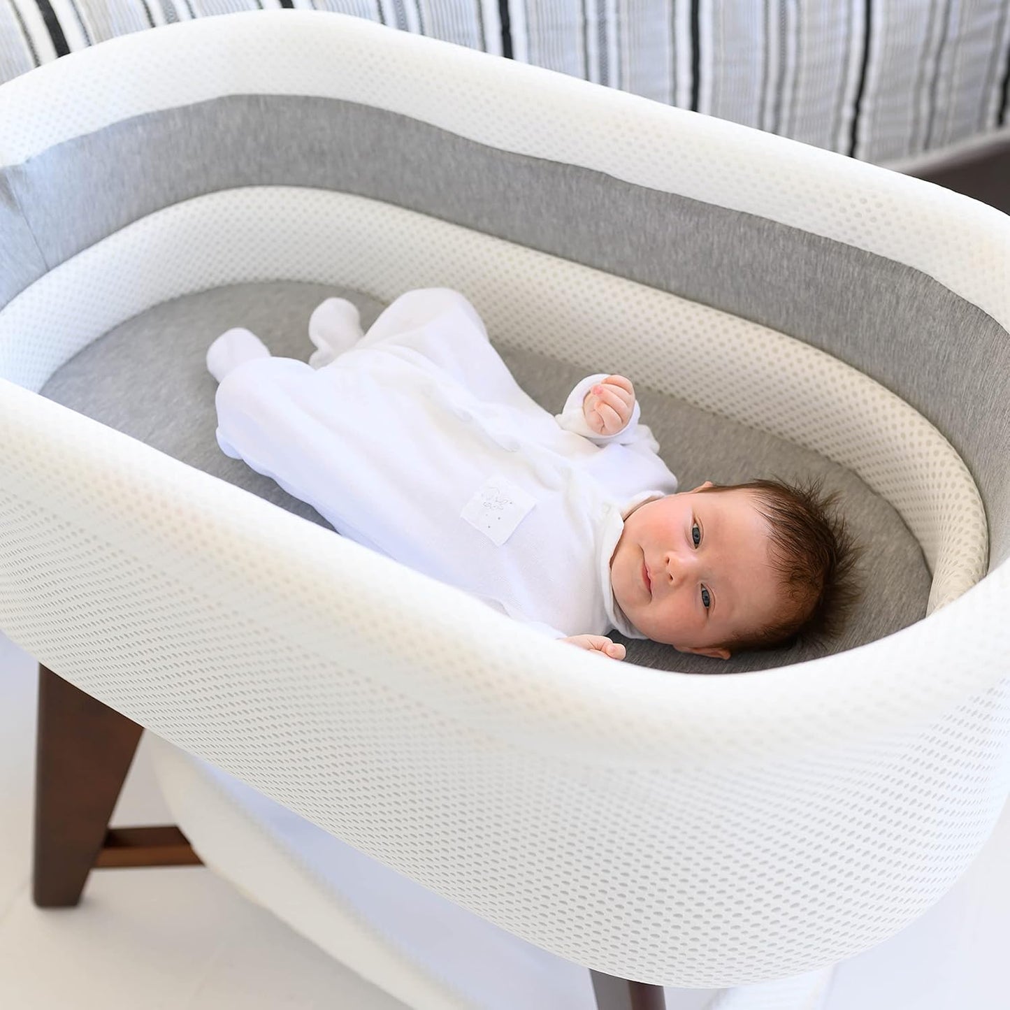 Evi Smart Baby Bassinet Beside Sleeper with Auto-Glide, Ambient Nightlight & Sensory Sounds, Compatible with Alexa and Google Home, Includes 2 Sheets (Soft White W/Natural Legs)